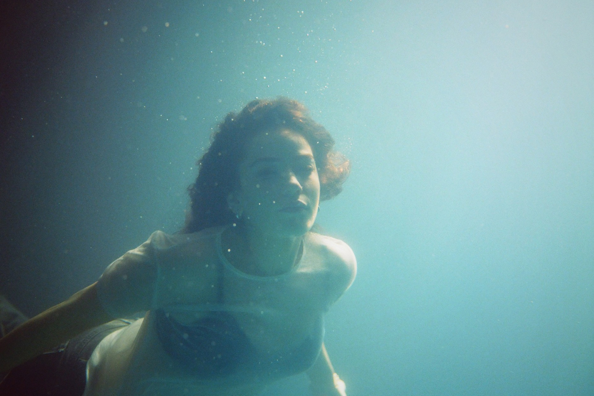 Talia Rae immerses herself in a surreal underwater world with her new ‘Rocket Woman’ video