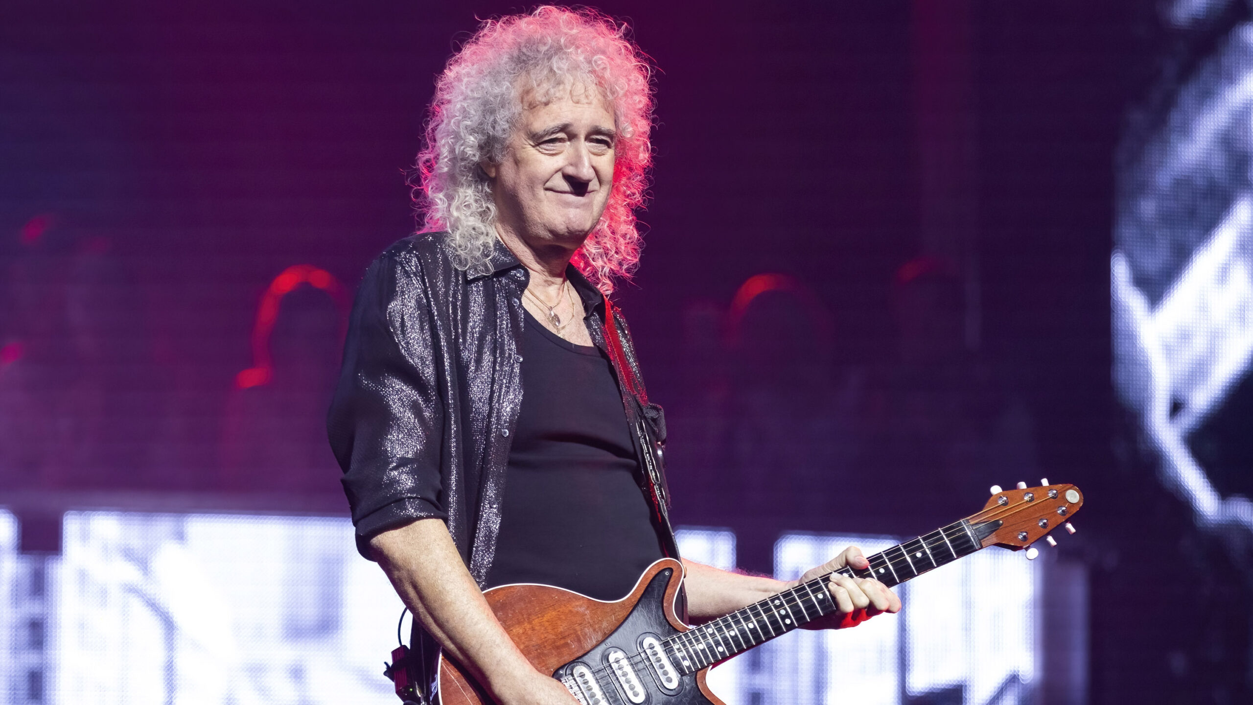 Queen’s Brian May reveals he was recently rushed to hospital after suffering minor stroke: “The good news is that I can play guitar”