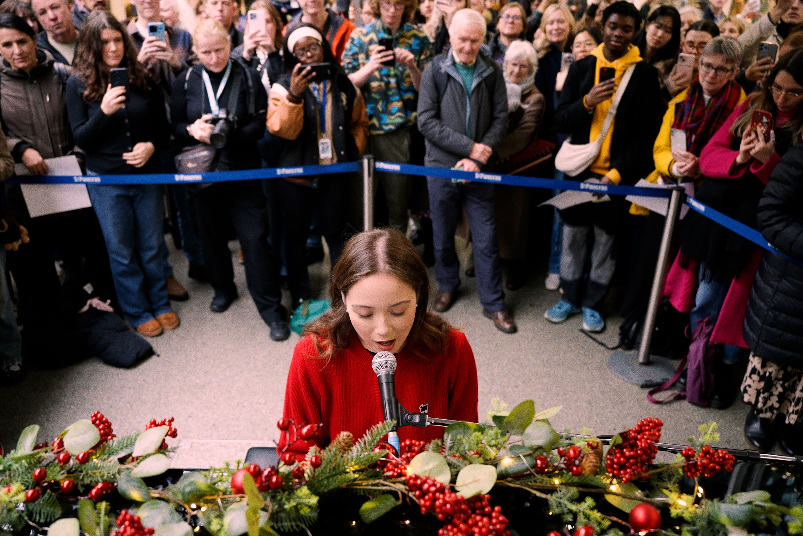 Laufey put on a surprise performance of Christmas songs at St Pancras station during her London visit