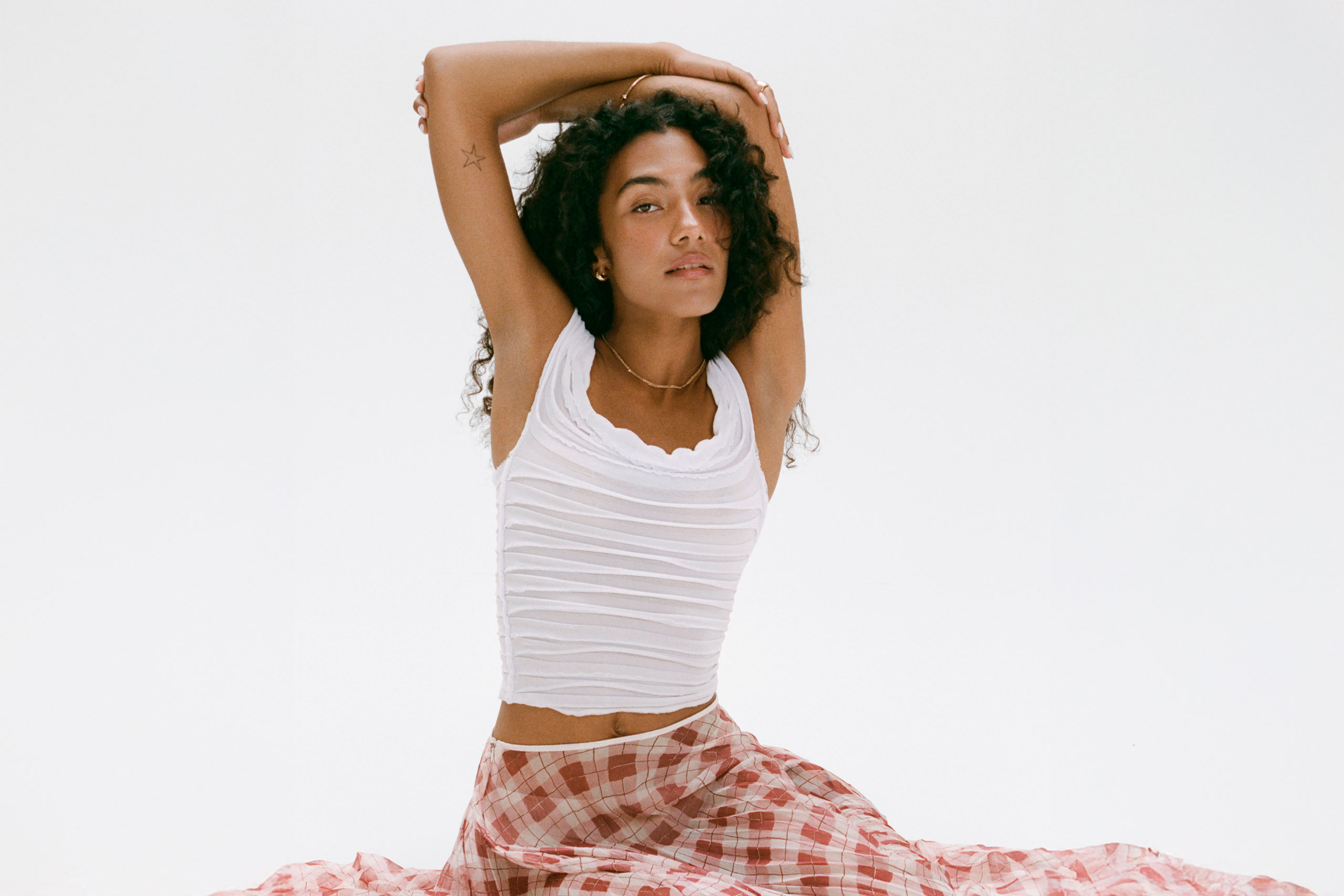 Olivia Dean has become the first female artist with four UK Top 10 singles simultaneously