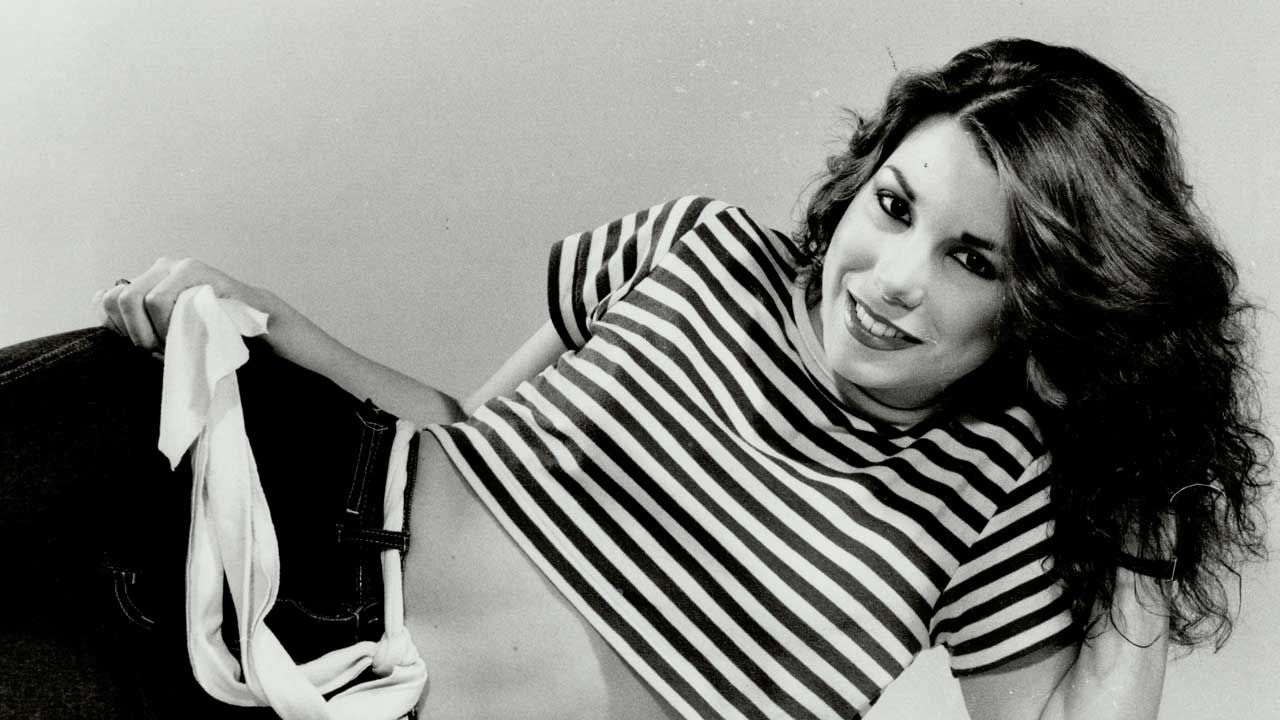 “The album cover and title song video are so sexually potent it almost makes you forget how Canadian the rest of the record is.”  What happened when Lee Aaron declared herself the Metal Queen