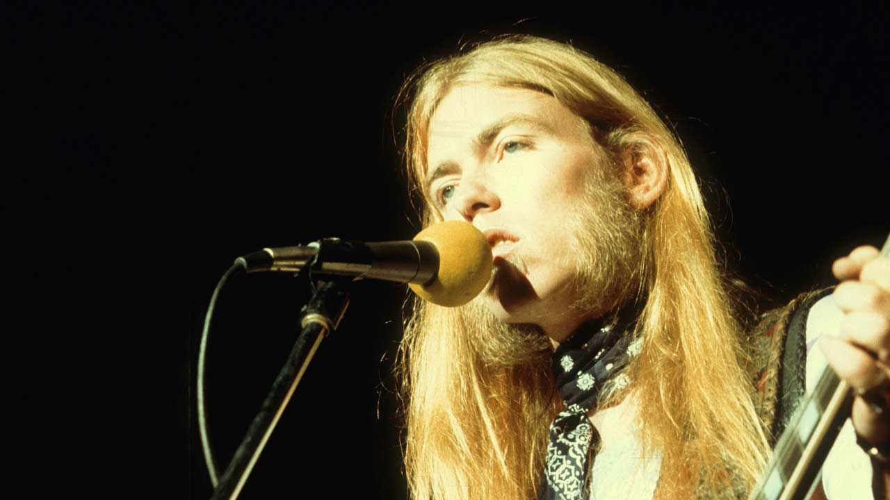 “Turn the lights down, put your feet up, whisky chaser in one hand, beer in the other.” A grieving Gregg Allman slows things down on the late-night gospel-country-blues of Laid Back