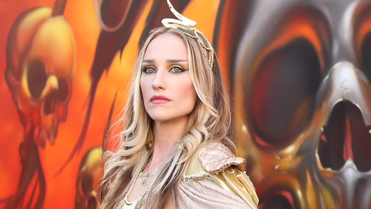 “I worked at the World Trade Center…I left at 2am on September 11.” From working as an opera singer, DJ and Playboy model to finding her true calling in heavy metal, the incredible story of Huntress singer Jill Janus
