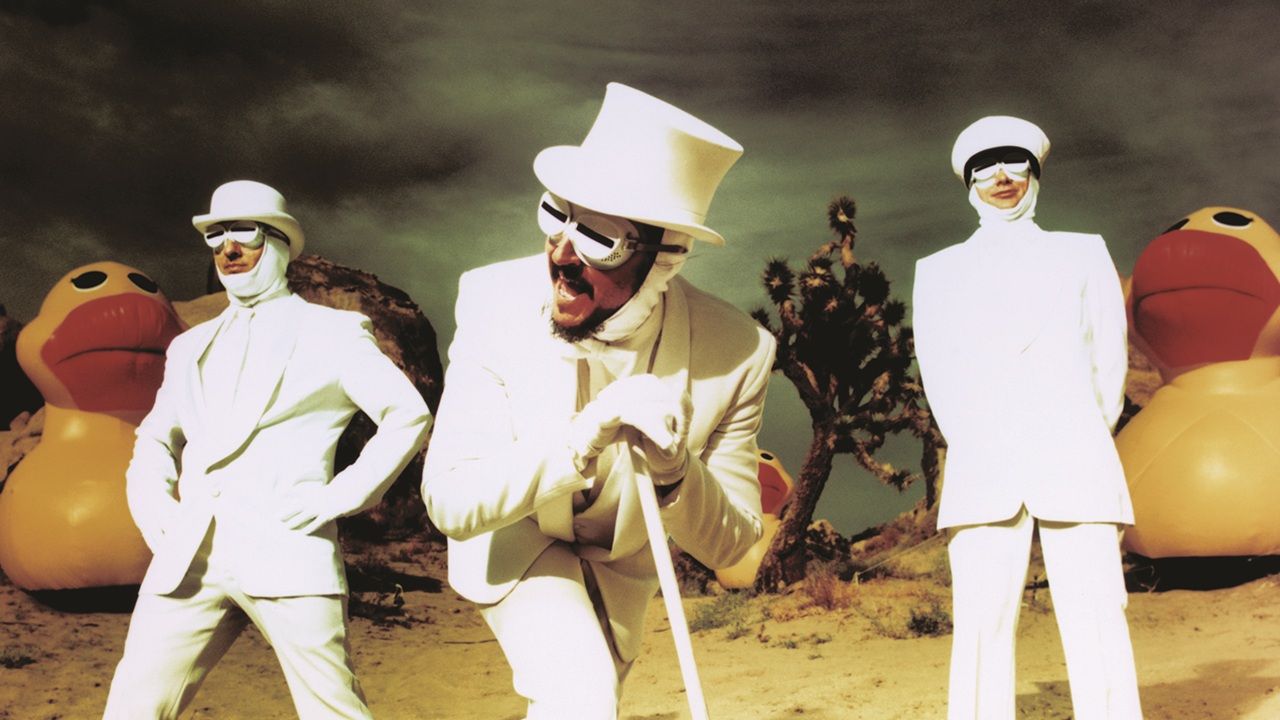 “There was a giant, red welt on my chest, and at my feet there was a huge pig’s foot with a big toenail on it.” How the world’s weirdest band went from cult outsiders to MTV mainstays
